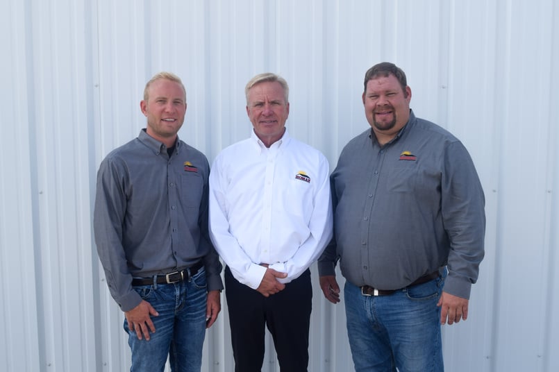 Eric Homan, Roger Homan, and Dale Everman pose for a photo